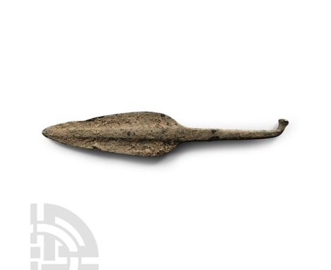 Early 1st millennium B.C. With foliate blade and raised mid-rib with the tang bent at the tip. Cf. Christie's, The Axel Guttm