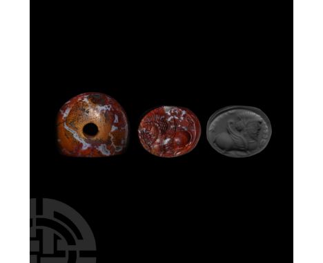 3rd-7th century A.D. Plano-convex in profile with intaglio motif of a winged gryphon with profile crowned head, text to the b
