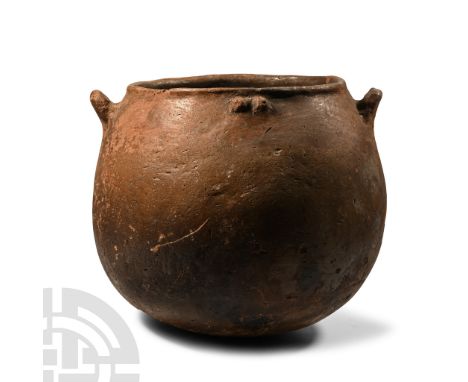 Early Bronze Age I-III, circa 2300-2000 B.C. Globular in profile with thick everted rim to the broad mouth, two ledge handles