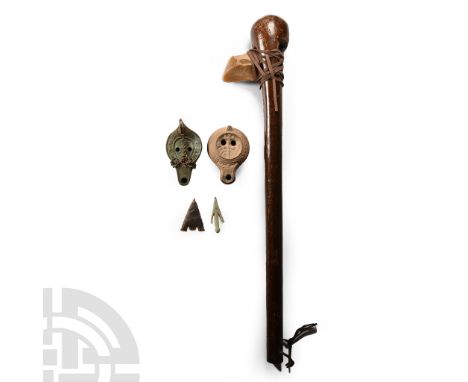 20th century A.D. Comprising: two ceramic oil lamps with lug handles; a bronze arrowhead; a flint arrowhead; knapped flint ax