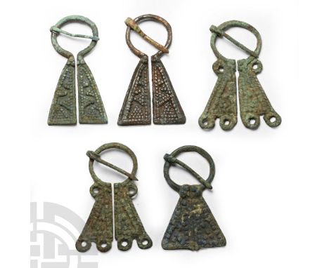 12th-14th century A.D. A group of flat-section Mordvinian type brooches. See Sedov, B.B., Finno-Ugri i Balti v Epokhi Srednev