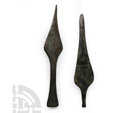 13th-7th century B.C. Comprising: leaf-shaped double-edged blade with rounded tip; thick rectangular-section handle with hear
