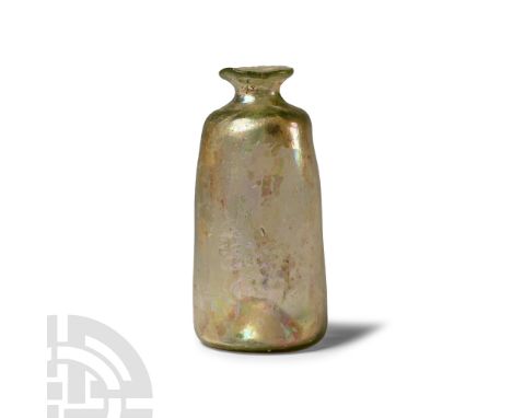 1st-4th century A.D. Comprising a dimple-based tubular body and bell-shaped neck with applied flange rim. See Harden, D.B. et