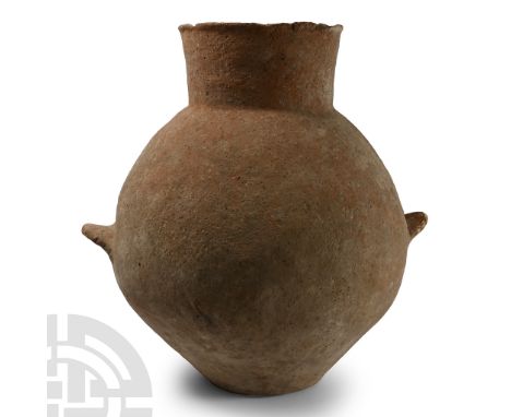 Bronze Age I, 2nd millennium B.C. Biconvex globular body with broad neck, everted rim, two ledge handles to the equator.  1.5