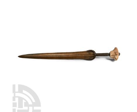 13th-7th century B.C. With solid cast hilt with penannular guard and a horizontally ribbed grip; a massive star-shaped pommel