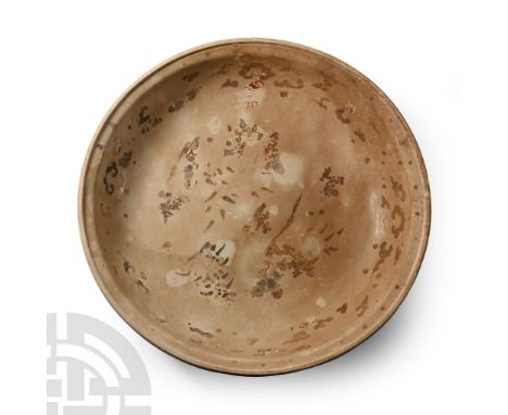 15th century A.D. Broad glazed bowl with substantial basal ring and rounded rim, band of cloud pattern motifs and floral moti