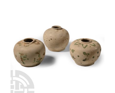 15th century A.D. Each a squat jar with basal ring and low mouth, applied floral motifs.  483 grams total, 77-79 mm (3 - 3 1/