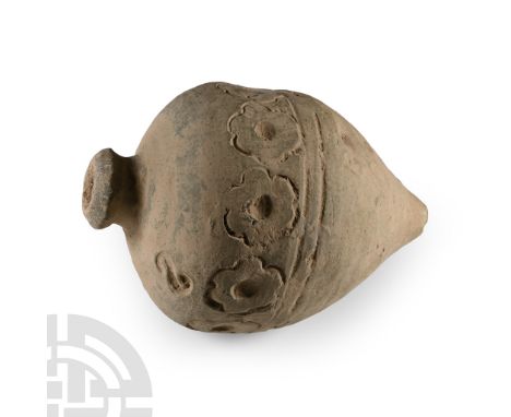 9th-11th century A.D. Piriform in profile with domed mouth, circumferential band of impressed rosettes to the equator. Cf. Ar