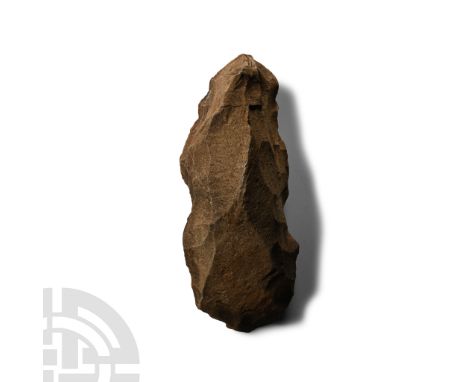 Neolithic Period, circa 2800 B.C. Triangular in section with thick butt; unfinished.  456 grams, 15 cm (5 7/8 in.). [No Reser