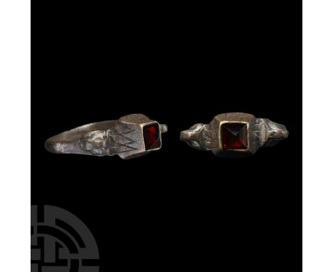 16th-17th century A.D. D-section hoop with loop to each shoulder, scooped cell to the bezel with inset facetted glass cabocho