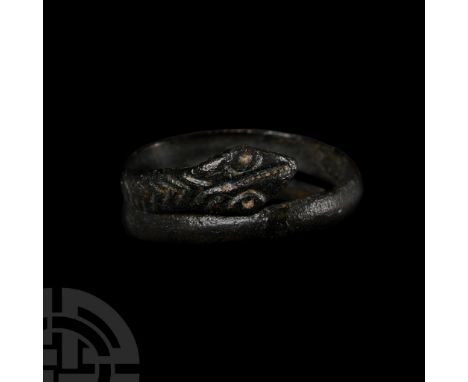 1st century B.C.-1st century A.D. Coiled body with one tapering terminal and the other formed the head of a snake with punche