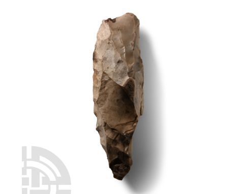 Mesolithic Period, circa 5000 B.C. Triangular in section with straight cutting edge, pointed butt. Cf. similar tool in MacGre