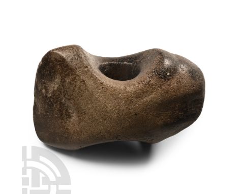 Neolithic Period, circa 4th-3rd millennium B.C. With broad butt and flat edge, deeply scooped profile to the socket rims; bla