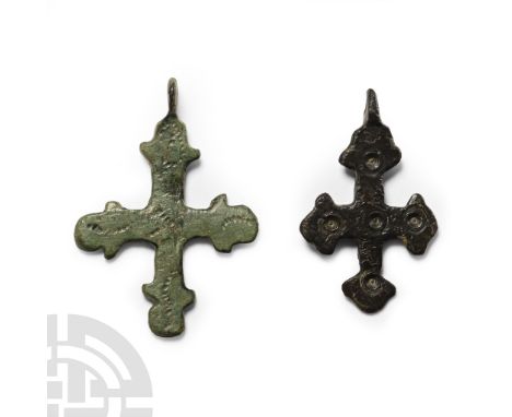 6th-8th century A.D. Comprising two cross pommée pendants, one with ring-and-dot motifs, the other with pointillé decoration.