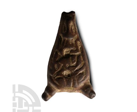 11th century A.D. Teardrop-shaped and slightly domed with loop at the apex (absent) and two radiating lugs at the lower corne