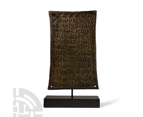 Circa 1st century A.D. Rectangular plaque with slightly flared ends, raised border and mounting hole to each corner; crenella