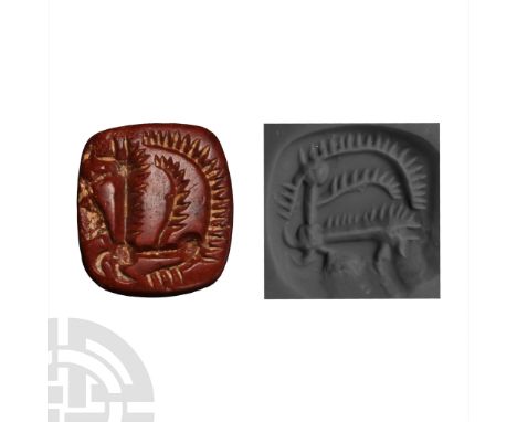 1st millennium B.C. Pyramidal in profile with stylised intaglio figure of a wolf in profile, crouching with exaggerated claws
