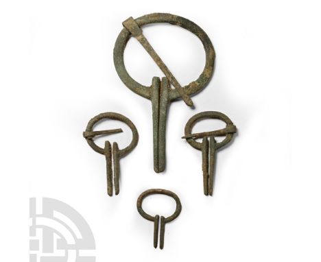 6th-8th century A.D. Penannular brooches each with two parallel arms running perpendicular to the ends of the ring; Finnish o