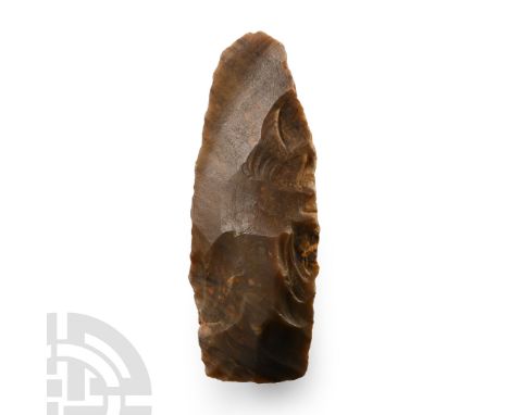 Late Mesolithic Period, circa 8000-6000 B.P. Triangular in section with rounded butt, straight cutting edge; beautiful exampl