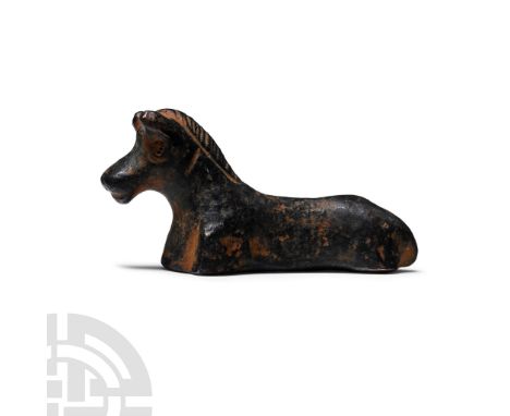 BRONZE TO IRON II AGE, CIRCA 12TH-6TH CENTURIES B.C. In the form of a horse reclining; inscription in Paleo-Hebrew or Phoenic