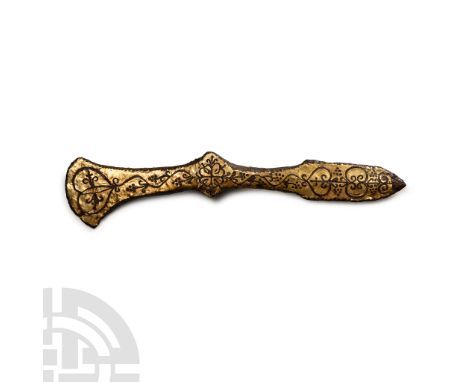 Circa 9th-12th century A.D. A miniature tzikourion comprising a crescentic blade with long neck, flared socket and leaf-shape