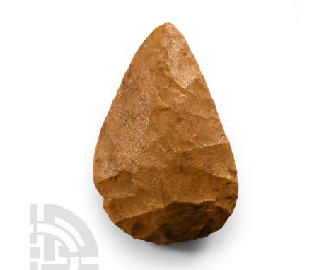 Palaeolithic Period, circa 200,000 B.C. Flaked cobble, lentoid in section with broad butt and rounded point. Cf. MacGregor, A