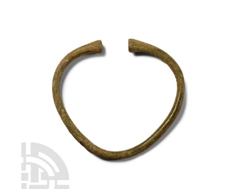 Late Bronze Age, 1st millennium B.C. Round-section shank with clubbed ends.  21 grams, 64 mm (2 1/2 in.). [No Reserve]Acquire