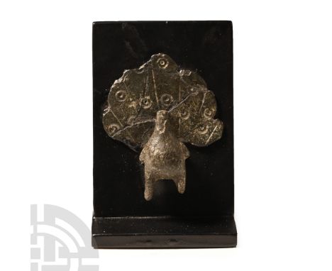 3rd-4th century A.D. With rounded body and small lateral wings, broad fanned tail with radiating lines and ring-and-dt motifs
