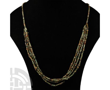 Late Period, 664-332 B.C. Multi-stranded designer necklace composed of beads of mainly annular and tubular types. Cf. similar