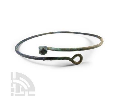 9th-12th century A.D. Round-section bar with loop to one end and polyhedral stud to the other. Cf. Sedov, B.B., Finno-Ugri i 