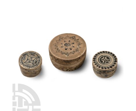 15th century A.D. Comprising three powder boxes with painted rosette to the lid, tendrils to the sidewall.  144 grams total, 