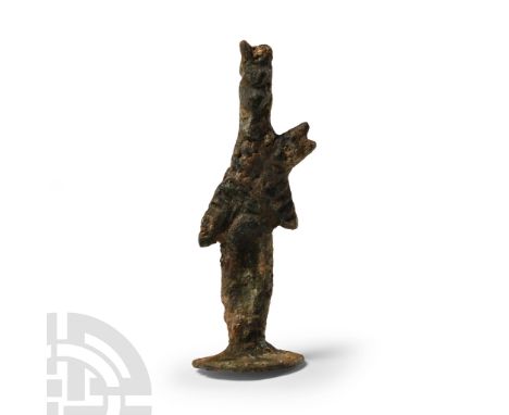 Early 1st millennium B.C. With hands raised, wearing a floral headdress and standing on a discoid base.  13.8 grams, 54 mm (2
