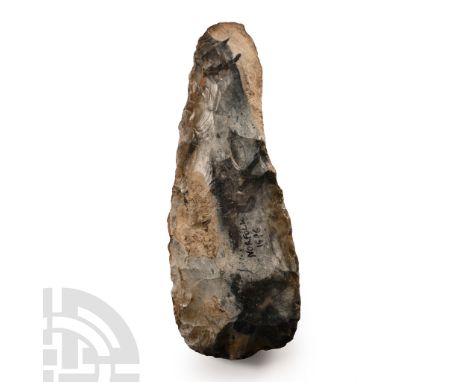 Neolithic Period, circa 4000-3000 B.C. Lozengiform in section with broad cutting edge, flat rounded butt. Cf. MacGregor, A. (