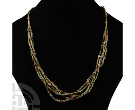 Late Period, 664-332 B.C. Multi-stranded designer necklace composed of beads of mainly annular and tubular types. Cf. similar