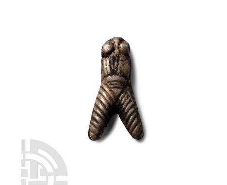 Late Period, 664-332 B.C. Formed as a fly with long triangular segmented wings, segmented body and domed eyes pierced for sus