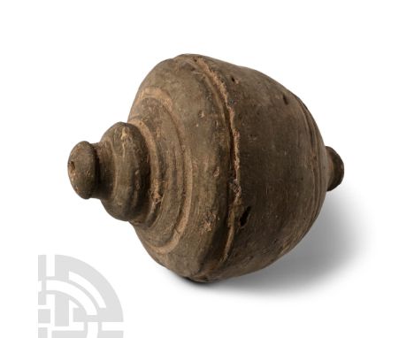 9th-11th century A.D. Piriform ceramic missile with domed filler-hole, concentric circle decoration to the body, intended to 