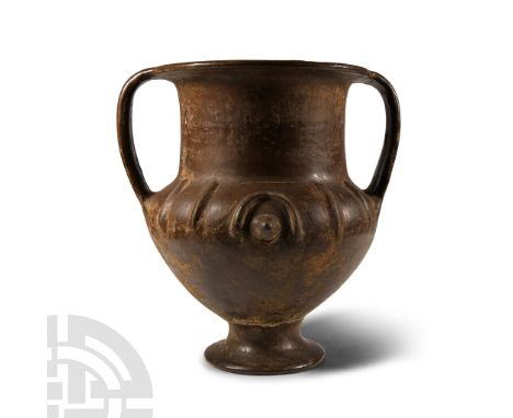 Circa 750-700 B.C. Comprising a wide foot beneath a squat stem with a bulbous body, a sloped shoulder beneath a columnar neck