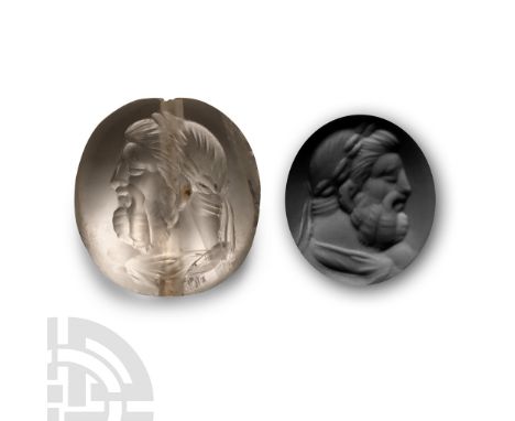 20th century A.D. Scaraboid in form and bearing intaglio male bust facing left, full beard and laureate crown, pierced for su
