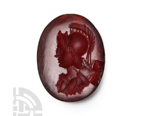 2nd-3rd century A.D. Carnelian with intaglio profile bust wearing a helmet; supplied with a museum-quality impression.  0.64 