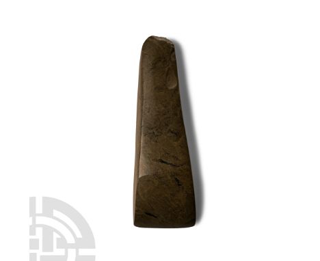 Neolithic Period, circa 4th-3rd millennium B.C. or later. Slender with a narrow rounded butt and shallow cutting edge; chippe