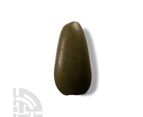 Neolithic Period, circa 4th-3rd millennium B.C. or later. With rounded butt and curved edge; old collector's inked legend 'Te