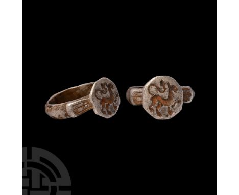 14th-15th century A.D. D-section hoop with raised ornamental band; scooped shoulders with trumpet-shaped bezel, intaglio lion