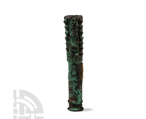 13th-7th century B.C. Of cylindrical shape, the upper section with alternating rectangular panels and vertical rows of three 