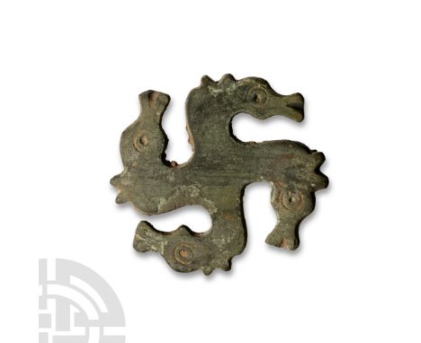 3rd-4th century A.D. With horse-head decoration to each arm, each head with punched ring-and-dot eye, and a similar motif to 