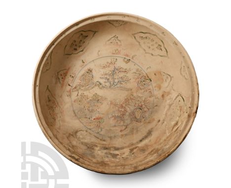 15th century A.D. Broad bowl with substantial basal ring, reserved petals to the outer face, tondo with stamped vesica-shaped