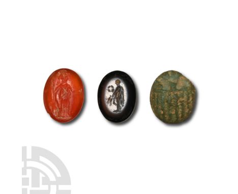 2nd century A.D. Group comprising: carnelian intaglio with figure of Minerva; nicolo with figure of Victory with wreath; glaz