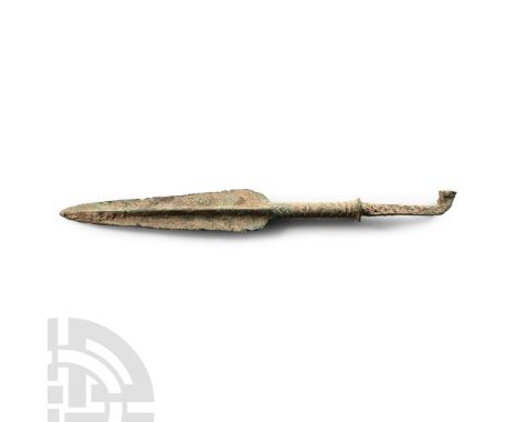 12th-11th century B.C. With heavily ridged and tapered leaf-shaped blade, long slightly flared grooved neck and square-sectio