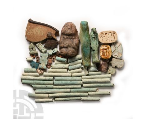 Mainly Late Period, 664-332 B.C. Comprising tubular and ring beads, wedjat-eye amulets, Bes amulets, scarabs, a Khnum amulet,