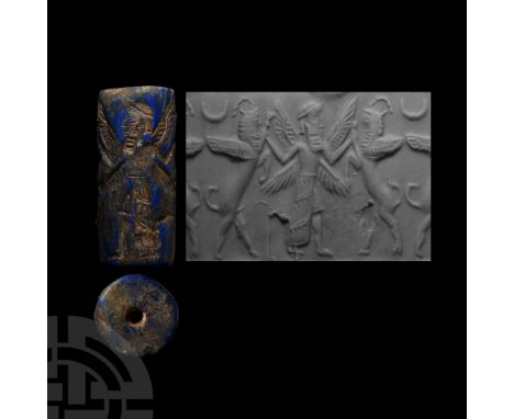 1st millennium B.C.&nbsp;With combat scene comprising a standing bearded male with ankle-length fringed kilt and four wings, 