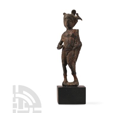 3rd century A.D. Modelled nude, standing on an ellipsoid base with mantle to the left shoulder and caduceus supported by the 